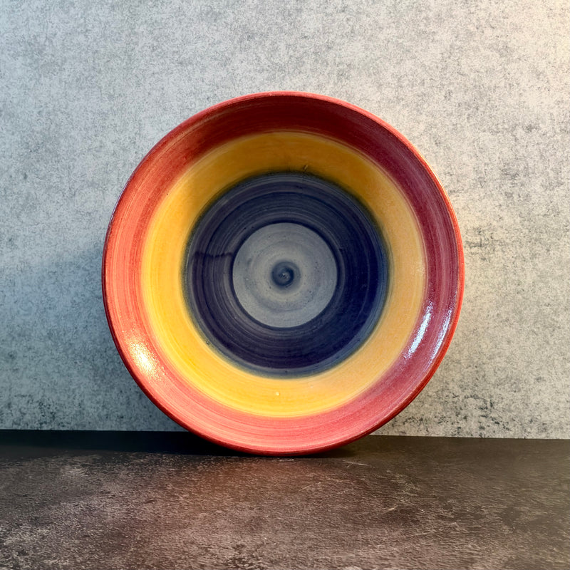 Solstice — Shallow Stoneware Bowl with Concentric Sun Glaze in Red, Yellow, and Blue