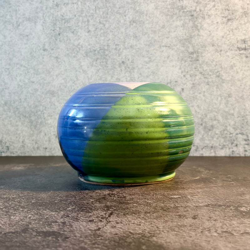 Orbit — Ribbed Spherical Stoneware Vessel Split in Deep Blue and Bright Green